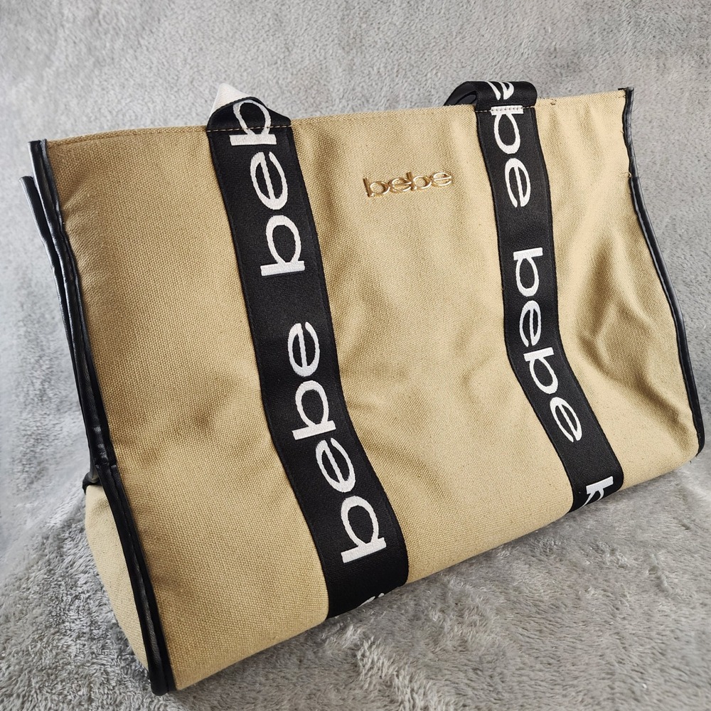 Bebe Tote Bag Tan Canvas Black Logo Webbing Straps Gold Hardware Large Shoulder